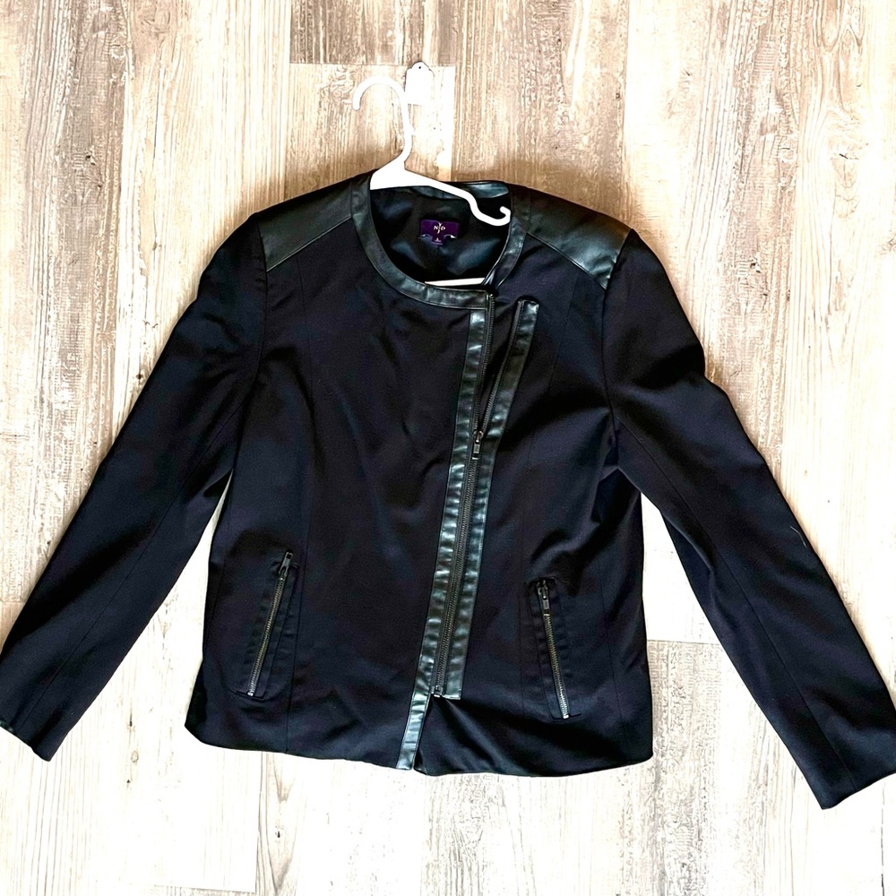 Black blazer with diagonal front zipper. Faux leather detail. NYDJ nrand